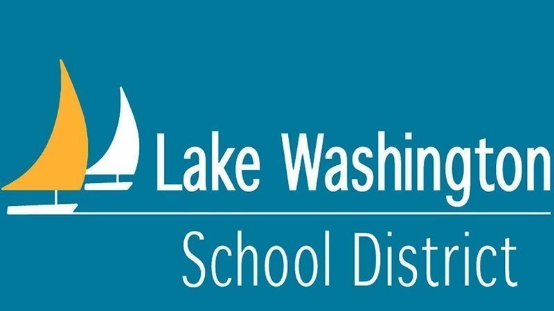 A blue sign with white lettering that says lake washington school district.